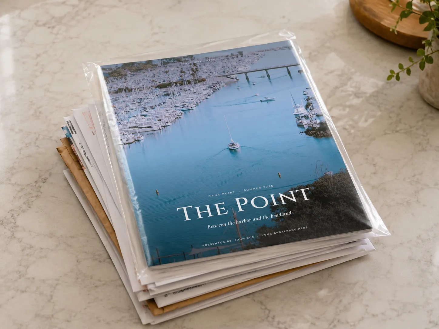 A stack of magazines, each sealed in an individual clear poly bag